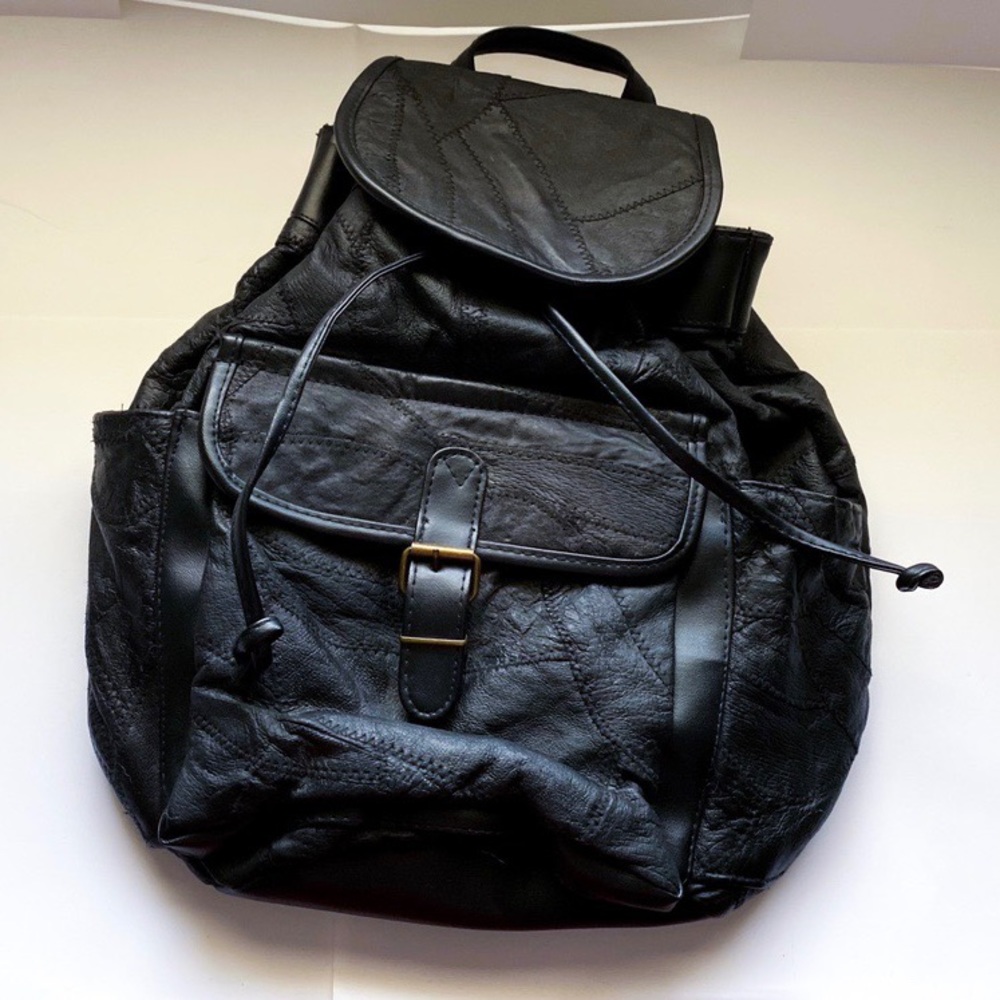 Faux leather over stitched backpack